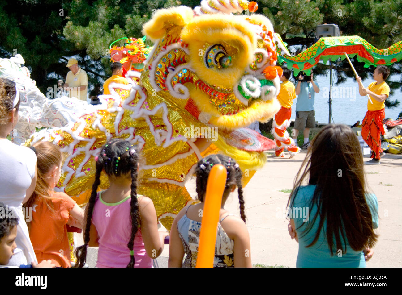 Asian dancing dragon entertaining children. Dragon Festival Lake Phalen
