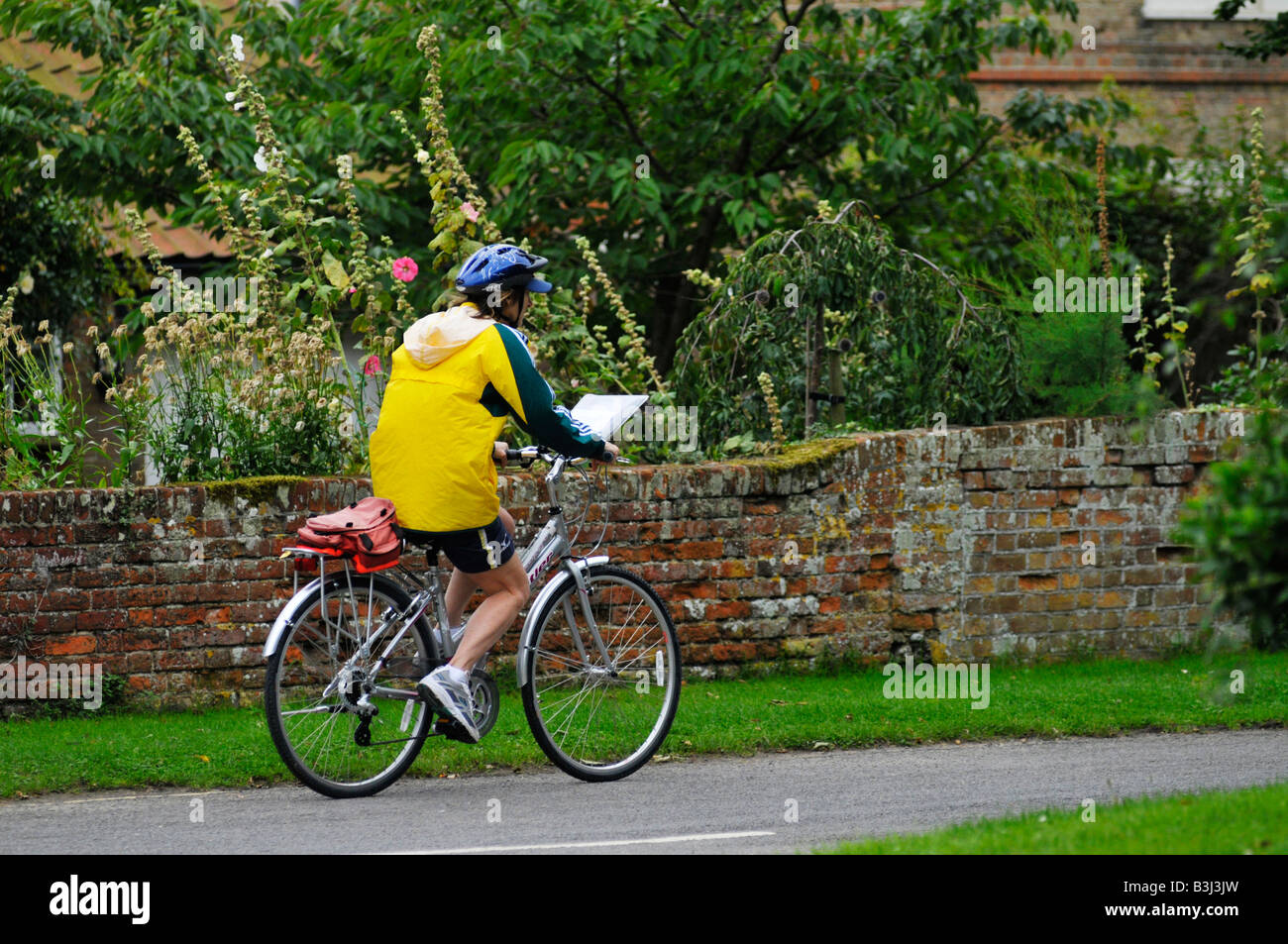 cyclist in orford, suffolk Stock Photo