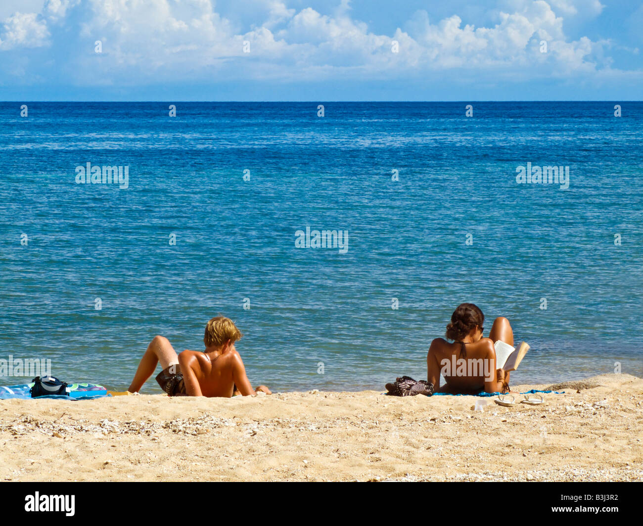 Two tourists relaxing on the beach Chalok Baan Kao Koh Tao Thailand JPH0096 Stock Photo