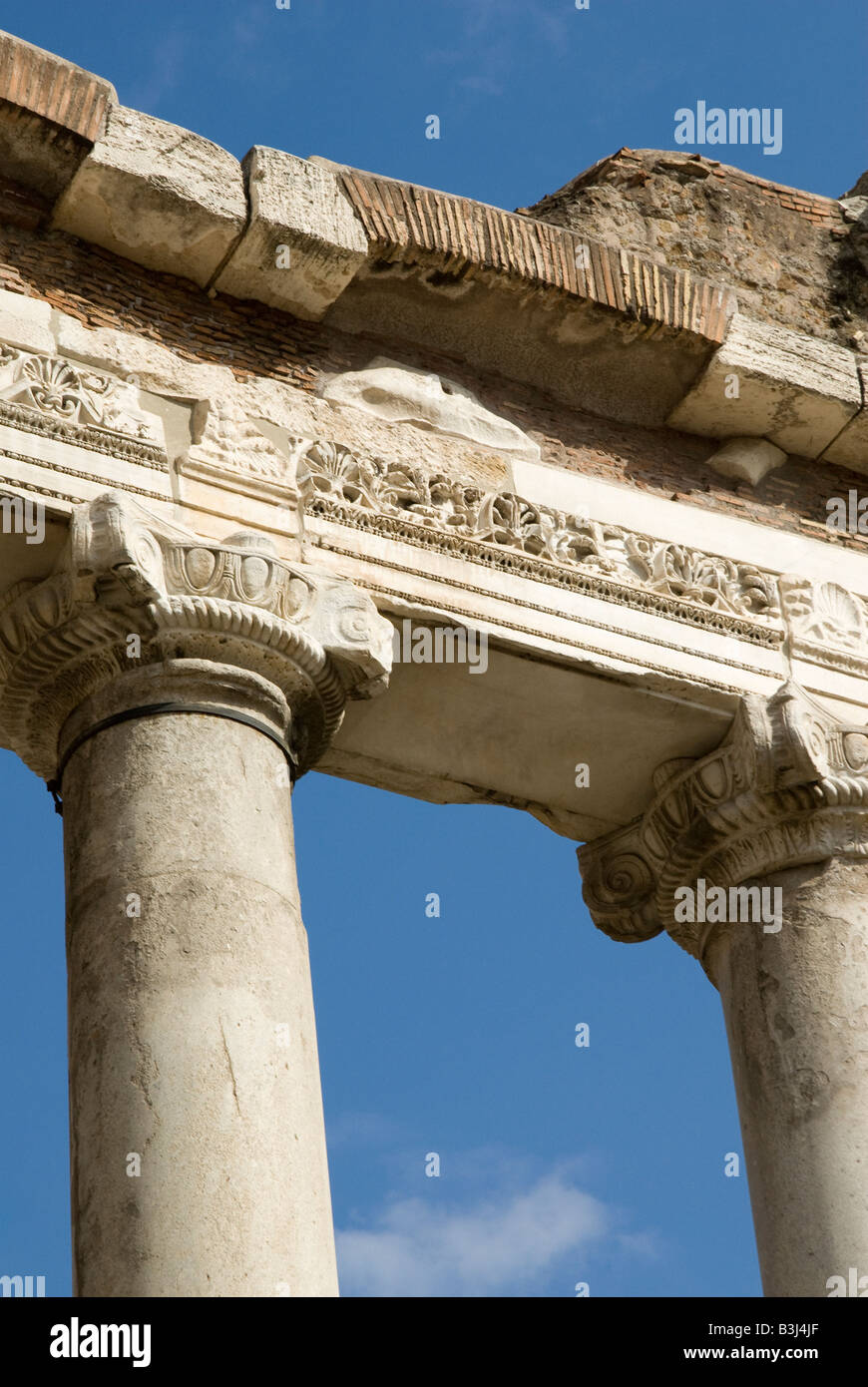 Eight surviving Doric columns of the Temple of Saturn on the Roman Forum in Rome Italy Stock Photo