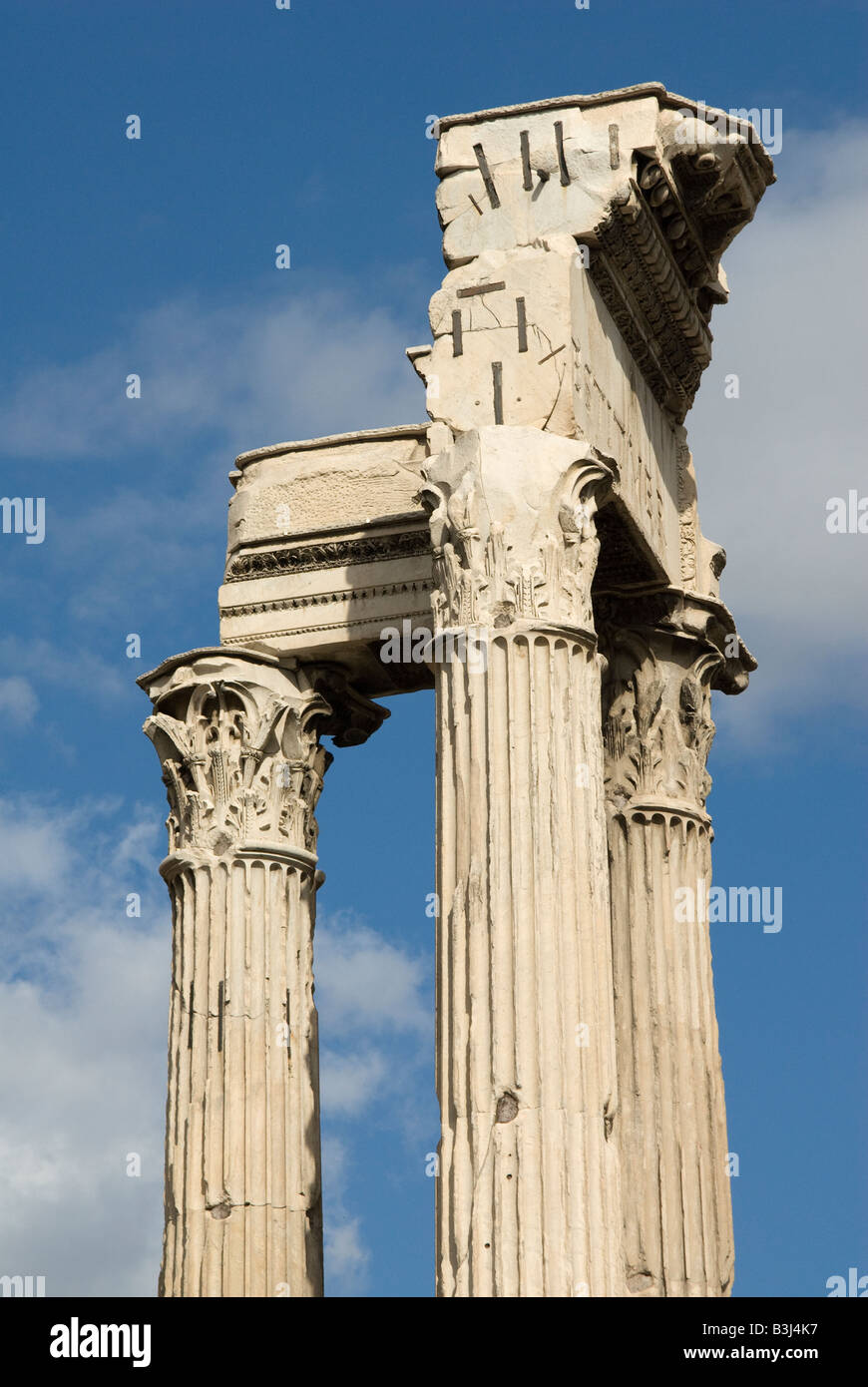 The three Corinthian columns of the Temple of Vespasian standing on the ...