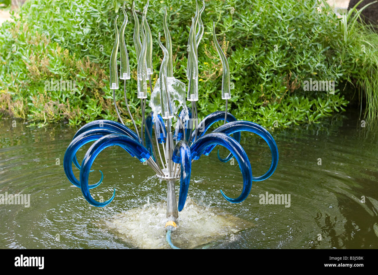Dizzy Lily blue glass water fountain by Neil Wilkin Stock Photo