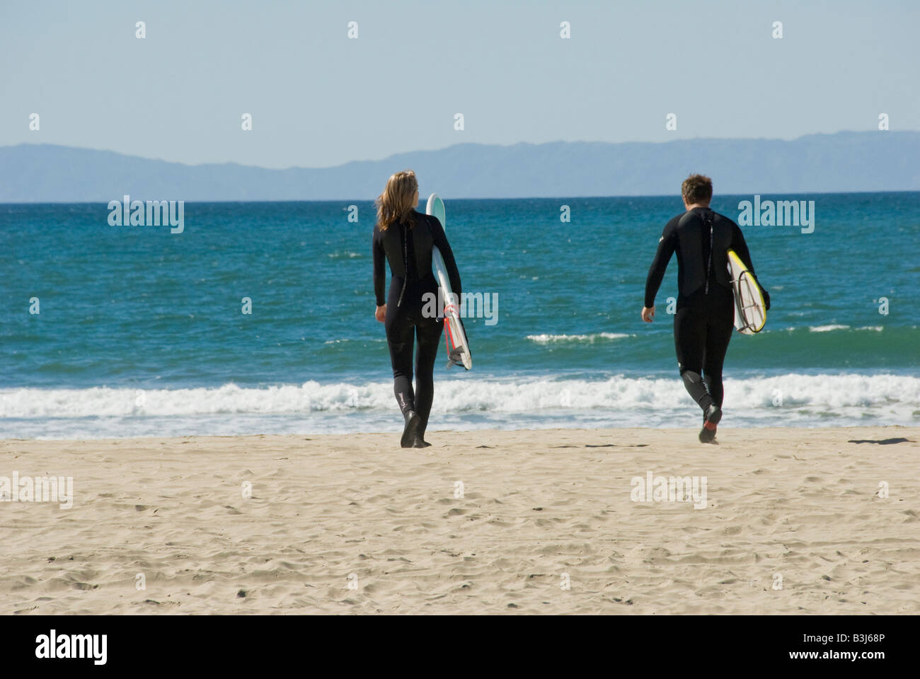 balboa peninsula surfer male female woman 20's newport beach orange county, california, ca usa three miles 5 km long, california Stock Photo