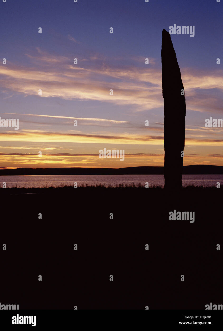 dh Stenness Standing Stones STENNESS ORKNEY Neolithic standing stone dusk sunset Loch of Stenness ancient scotland Stock Photo