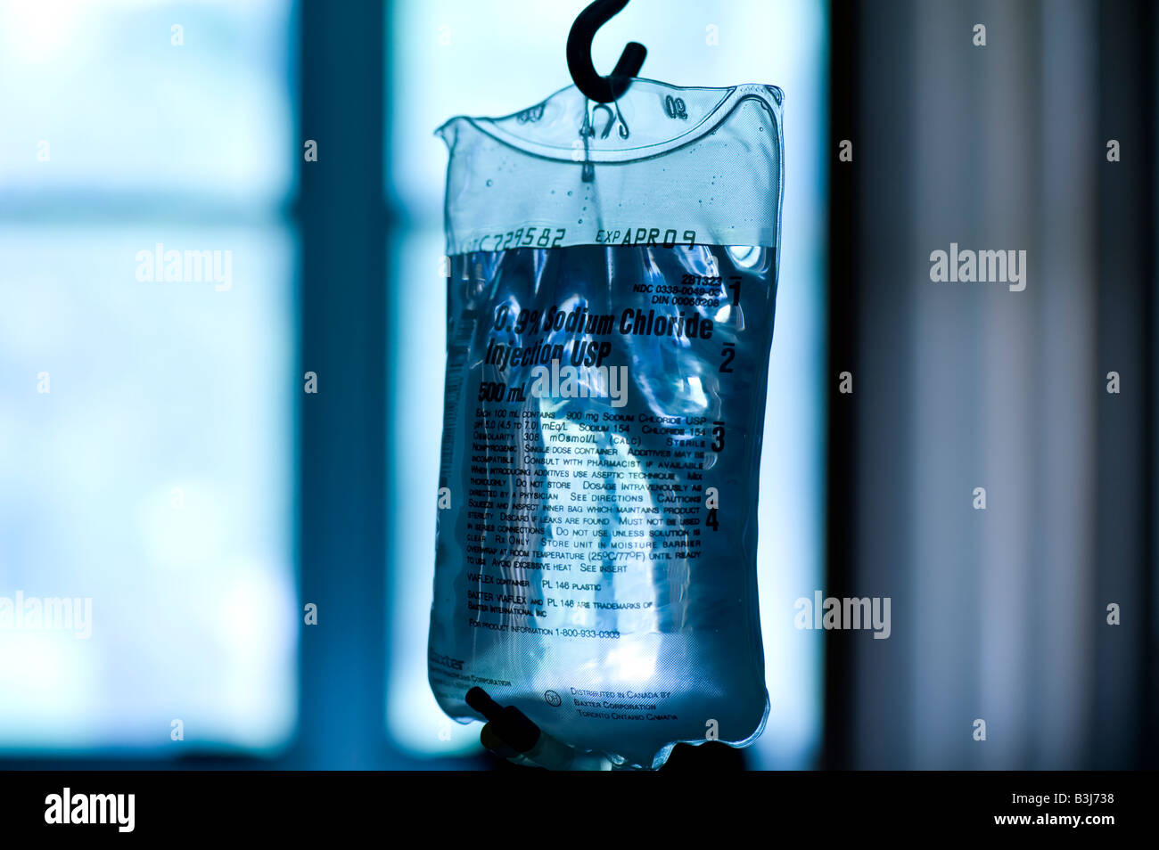 IV intravenous bag hanging in hospital intensive care ward for cardiac patients Stock Photo