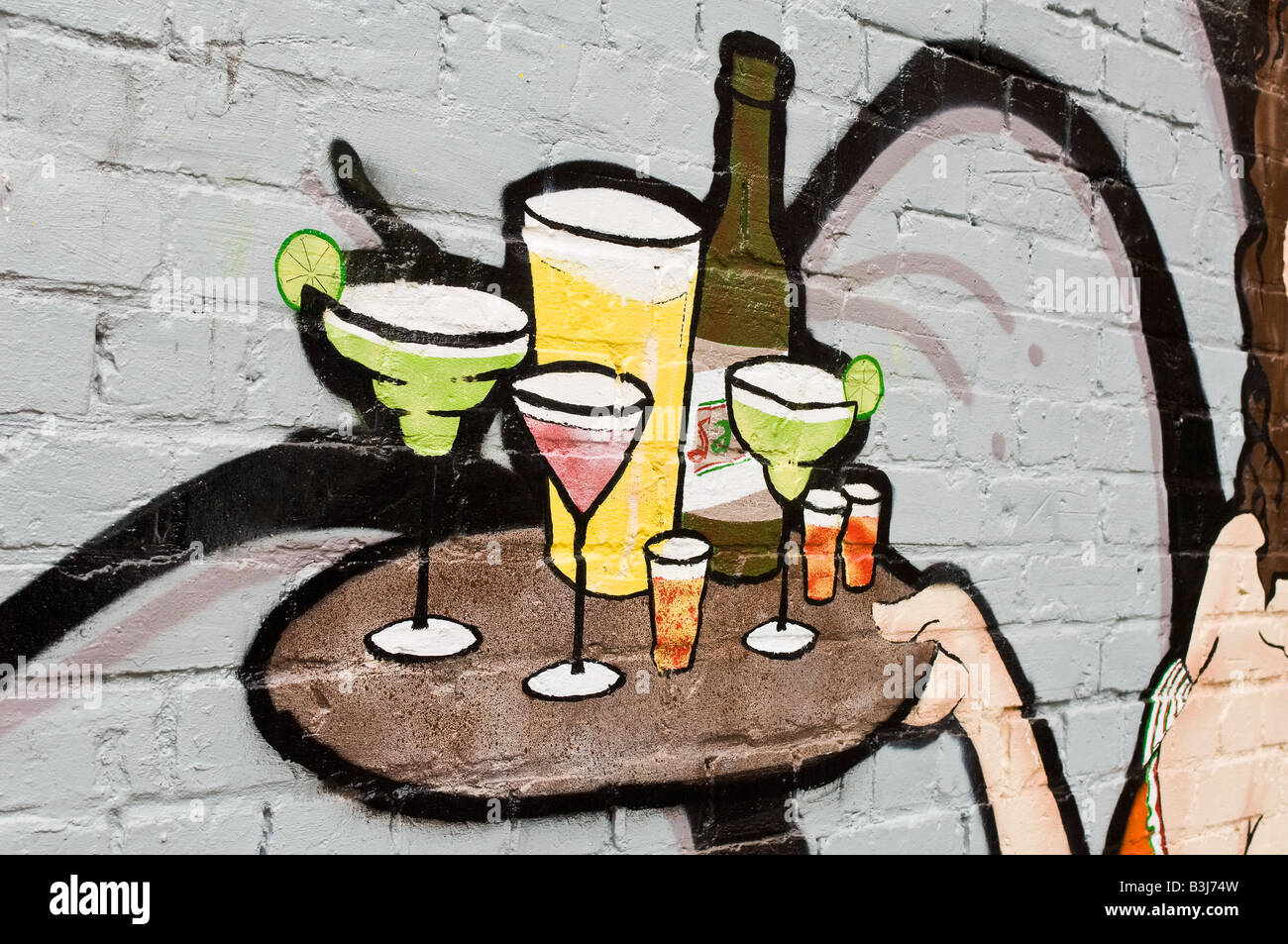 detail of wall painting of cocktail waitress tray of drinks Stock Photo