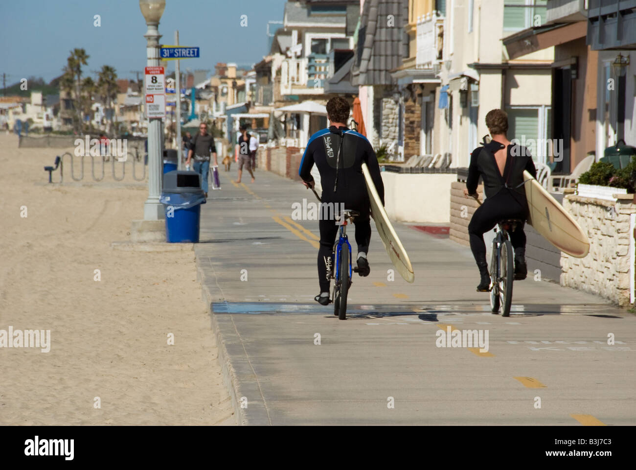 Surfers on bikes balboa peninsula newport beach, orange county, california, ca usa three miles 5 km long, california Stock Photo