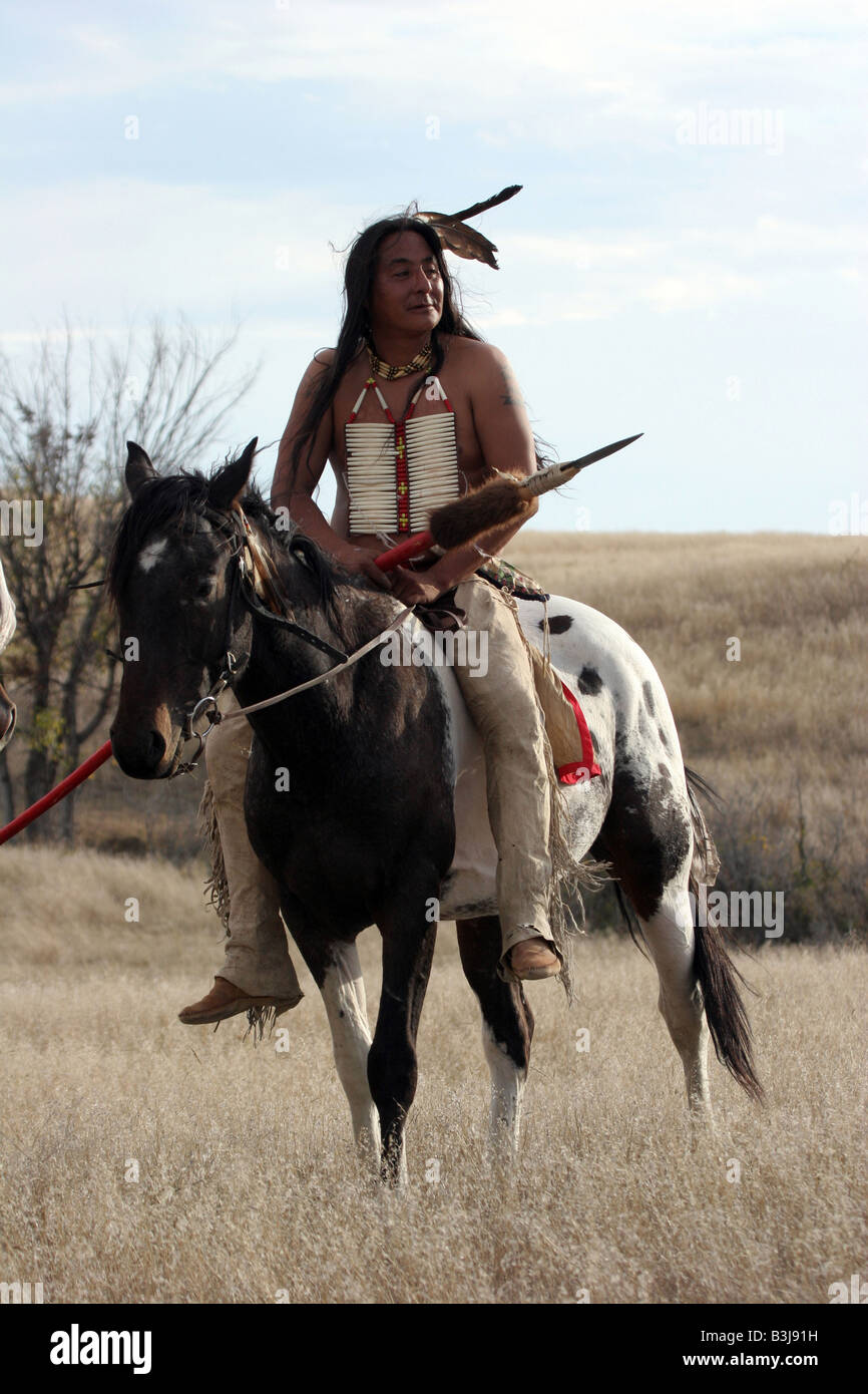 A Native American Indian on horseback in South Dakota with a eagle ...