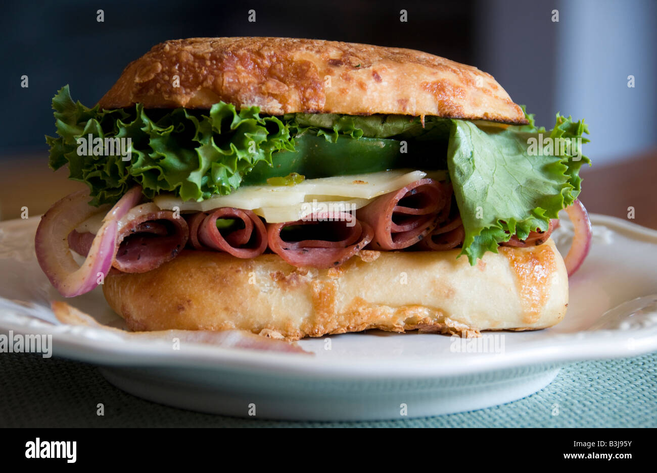 A Pastrami and Swiss cheese sandwich on Asiago cheese bread Stock Photo