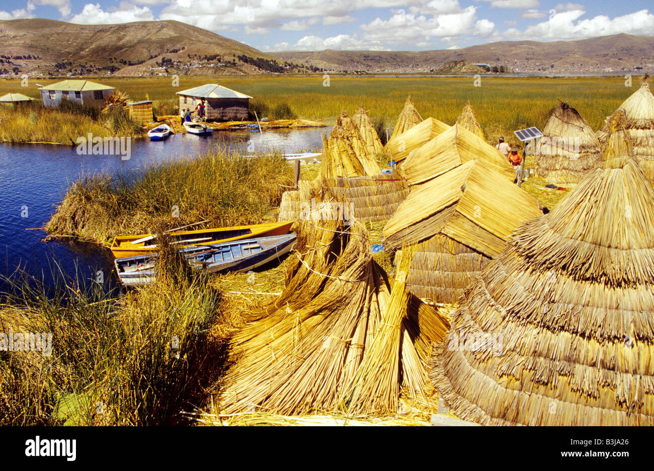 Floating islands and Huts made of reed of the Uru people of lake Titikaka aka Titicaca in Puno, Peru Stock Photo