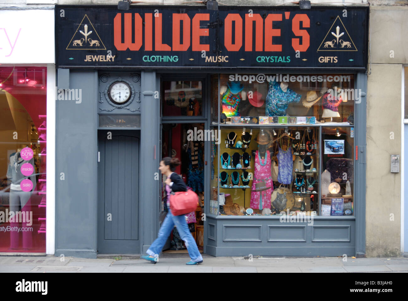 Young woman passing Wilde One's alternative fashion shop in the King's Road Chelsea London England Stock Photo