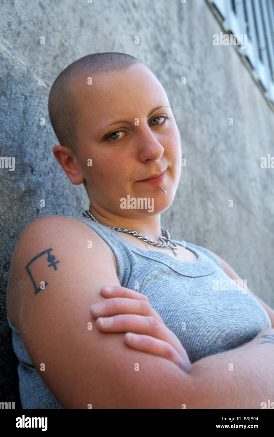 portrait skinhead girl with tatoos and piercings Stock Photo