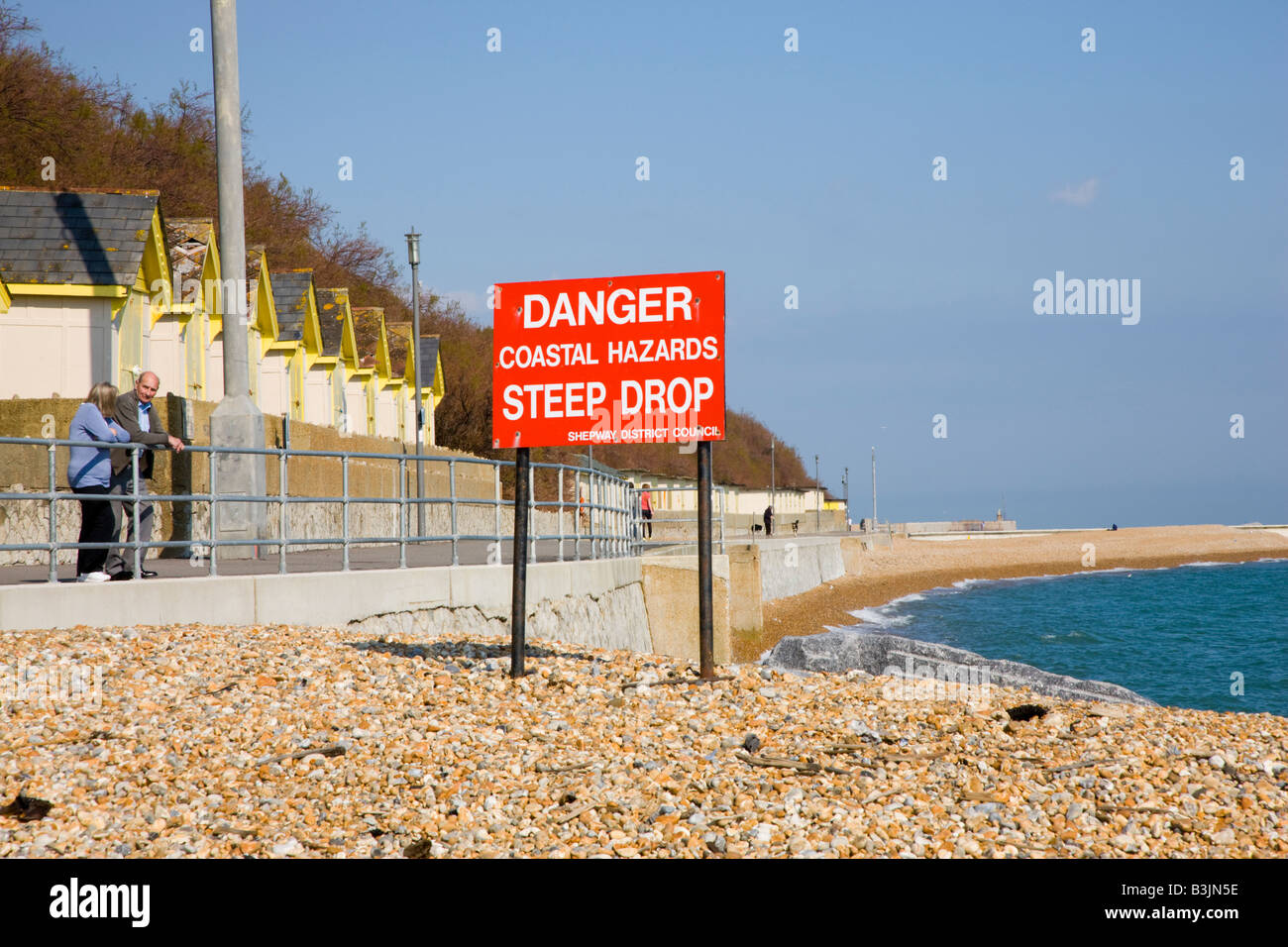Sign stating Danger Coastal Hazards Steep Drop Stock Photo