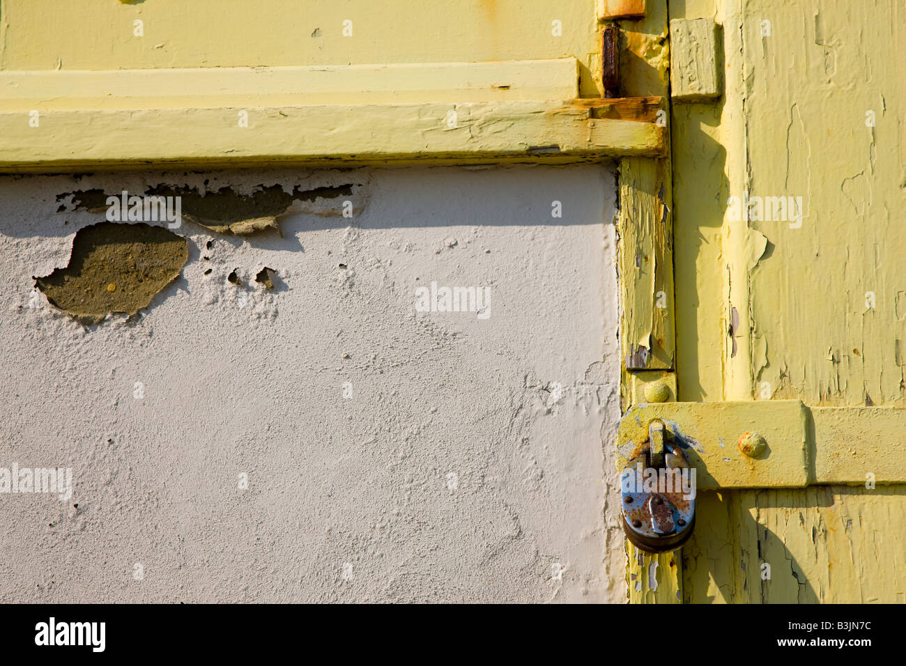 Padlocked shutter on beach hut Stock Photo