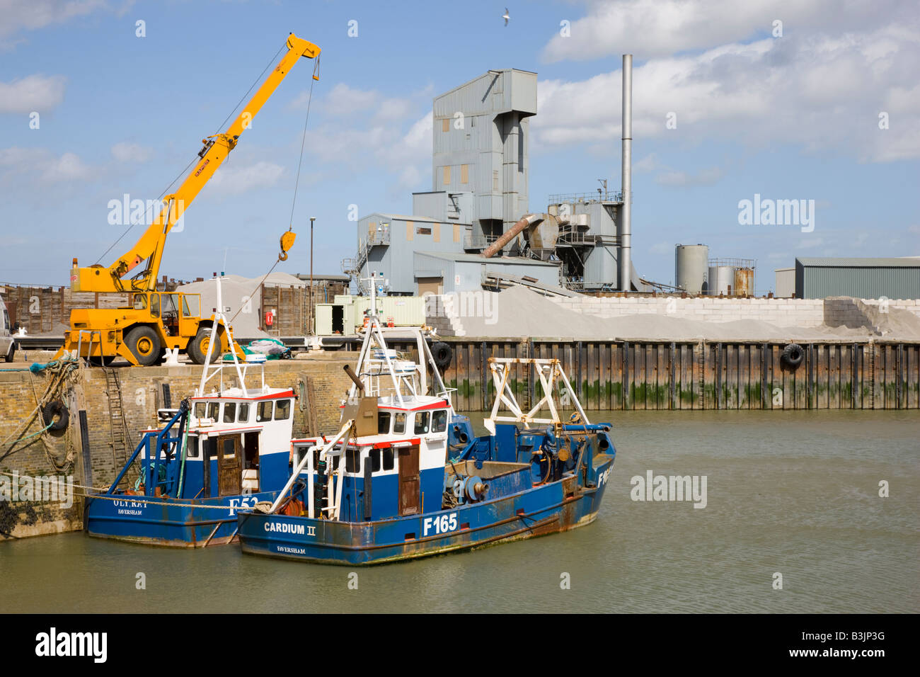 Crane and machinery on the harbour quay in Whitstable Kent Stock Photo