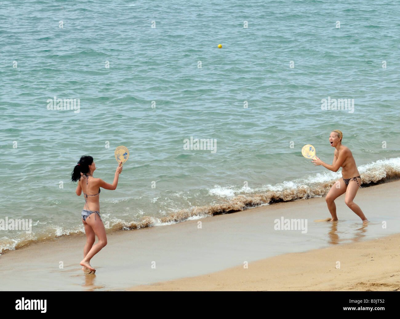 Young topless women playing beach tennis near Biarritz, in south-west  France Stock Photo - Alamy