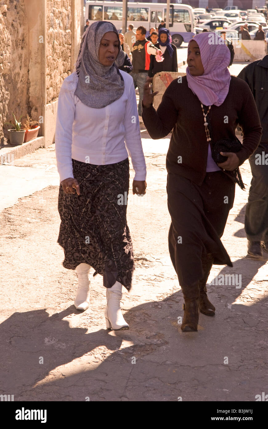 Libyan women walking through Medina or Old City Tripoli Libya Stock Photo