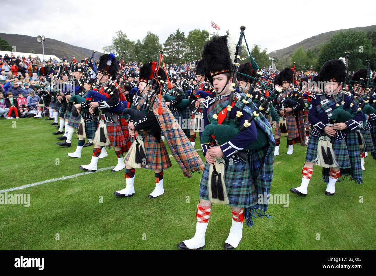 Crowds watching the massed bands at the famous Braemar Gathering and Games in Aberdeenshire, Scotland, UK Stock Photo