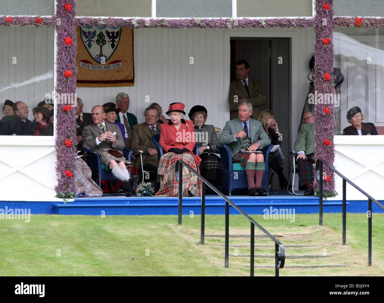 The Queen, Prince Philip and Prince Charles sitting in the Royal Pavillion at the Braemar Gathering in Aberdeenshire, Scotland Stock Photo