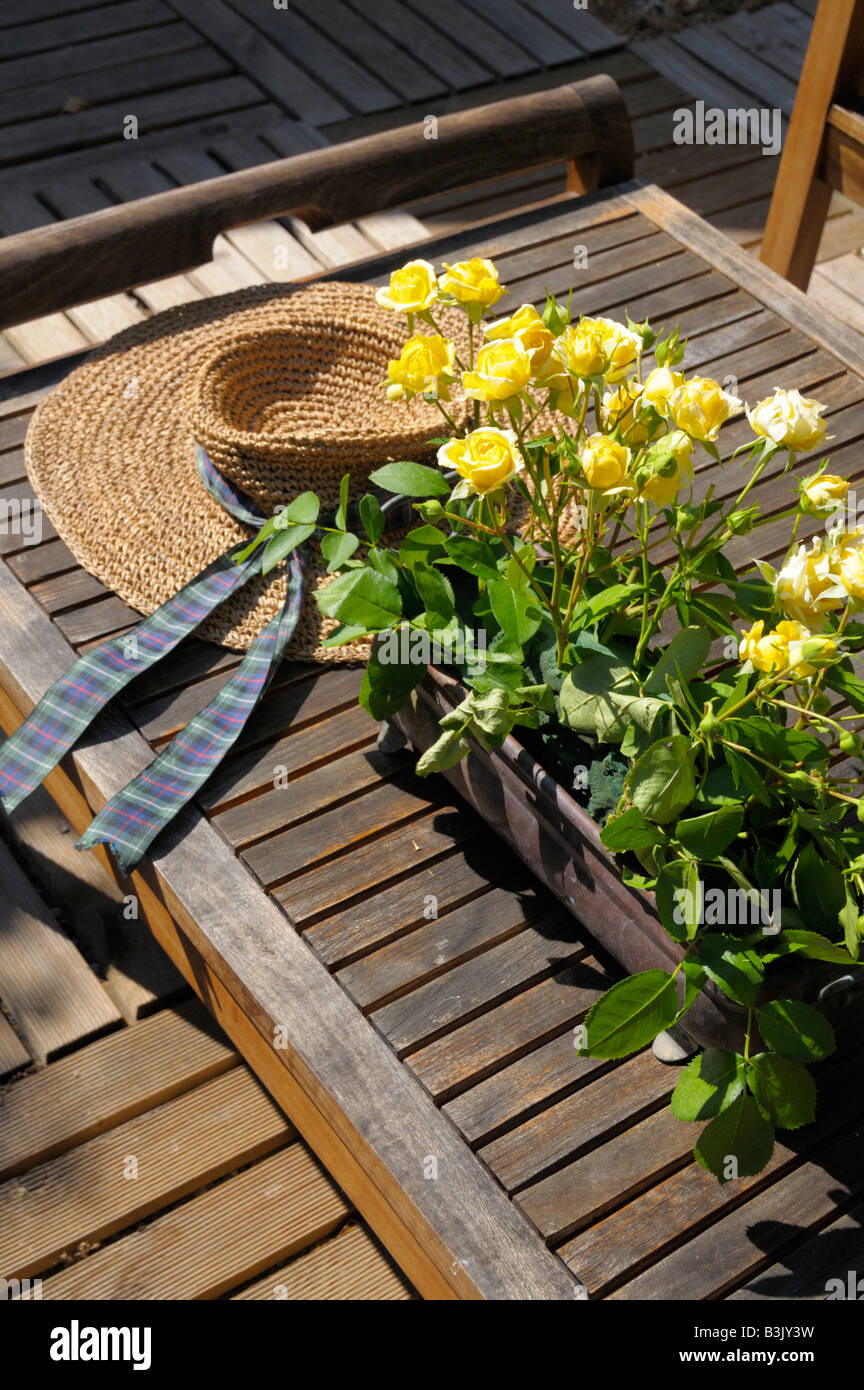 Nice Cote d'Azur France sunhat with roses on picnic table Stock Photo