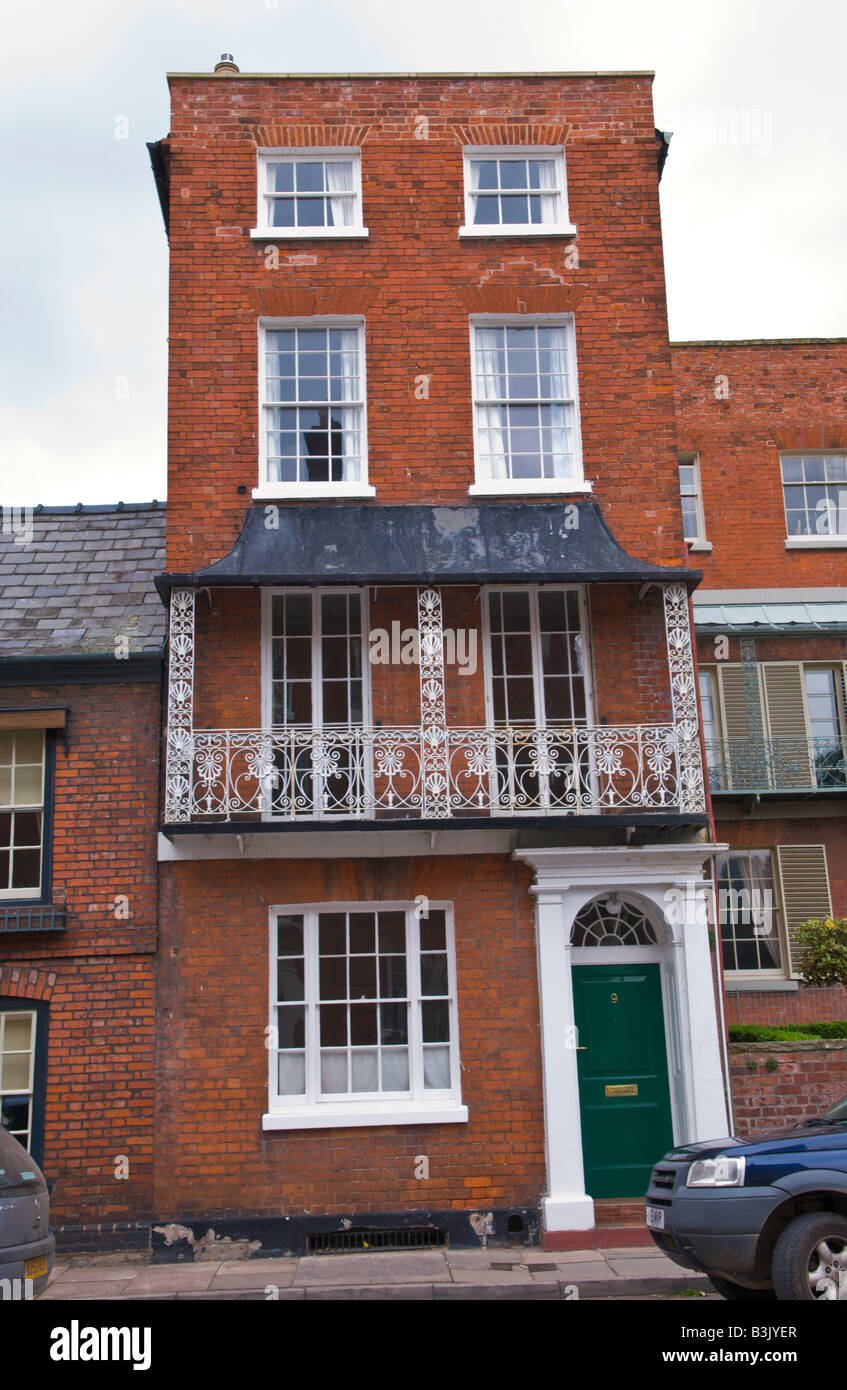 House with Georgian brick facade and wrought iron balcony in city centre Hereford Herefordshire Stock Photo