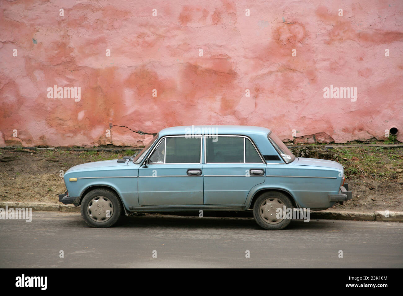Old dirty blue Lada saloon car in Lviv or Lvov, Ukraine. Stock Photo