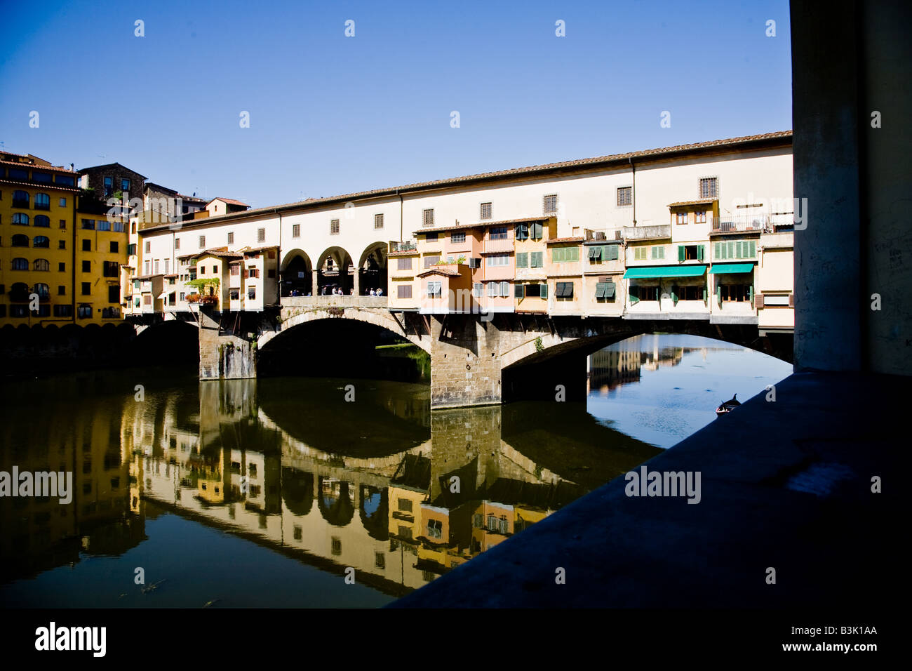 The Ponte Vecchio the ancient bridge that is a shopping street across the Arno Fiume Stock Photo