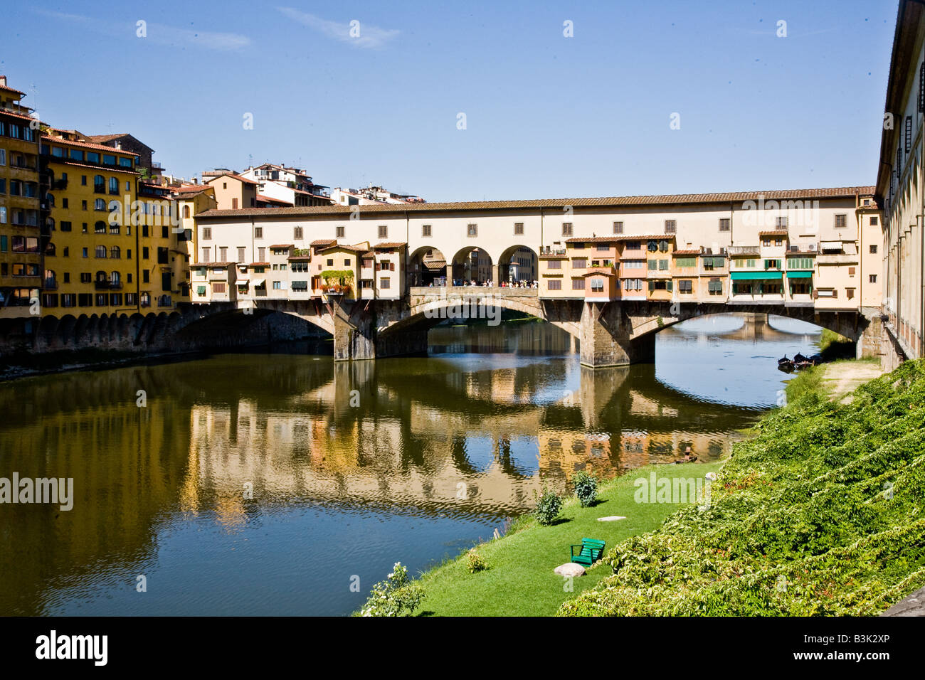 The Ponte Vecchio the ancient bridge that is a shopping street across the Arno Fiume Stock Photo