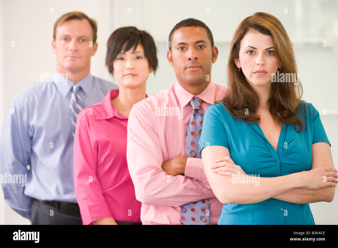 Business team standing indoors Stock Photo