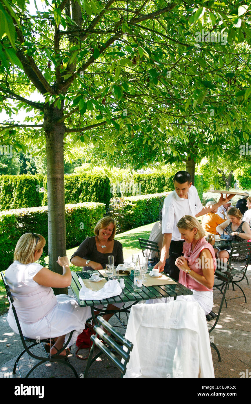 July 2008 - People sitting at the outdoors cafe of the Musée d Art Américain in Giverny Normandy France Stock Photo