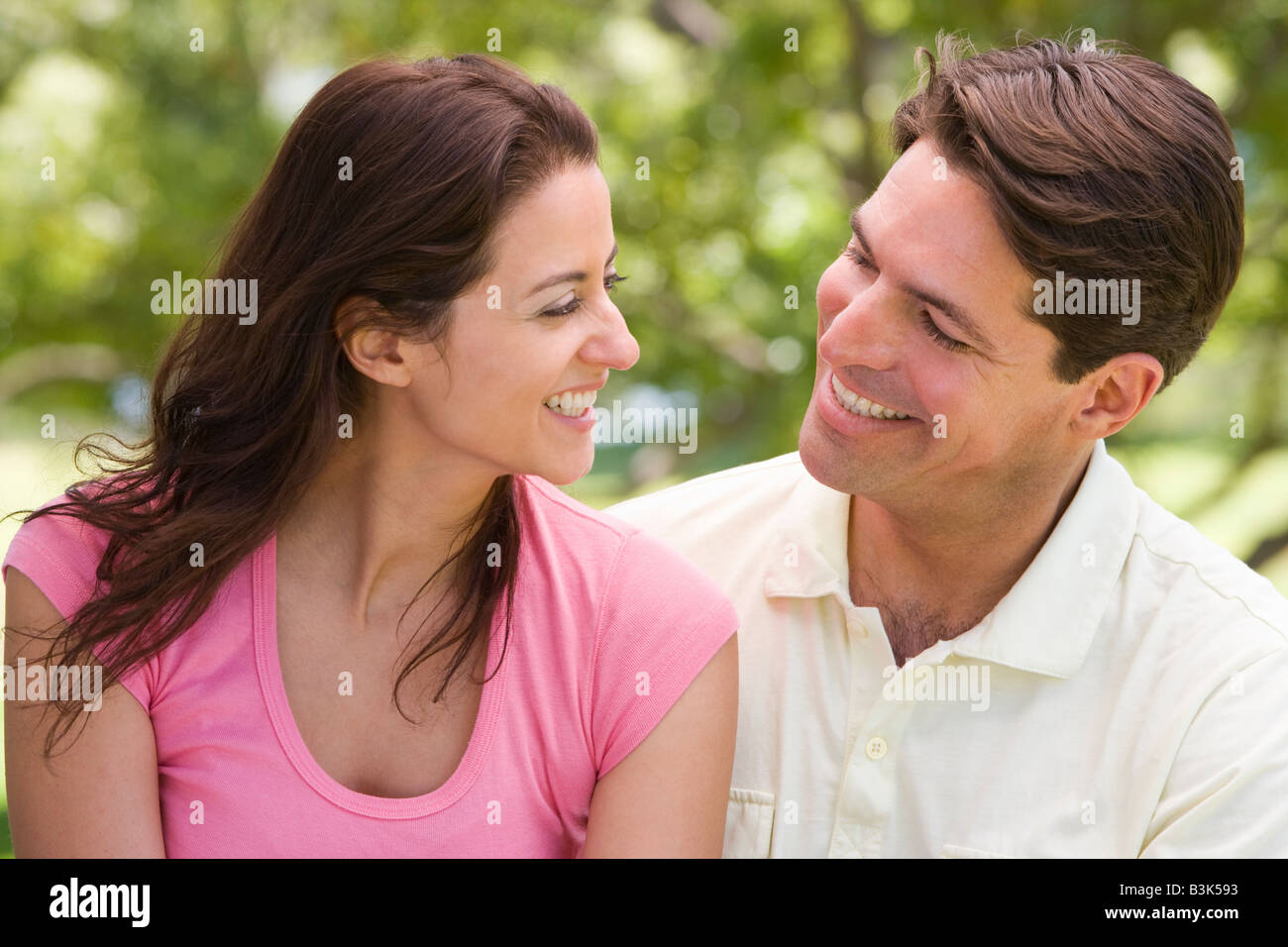 Couple outdoors smiling Stock Photo - Alamy