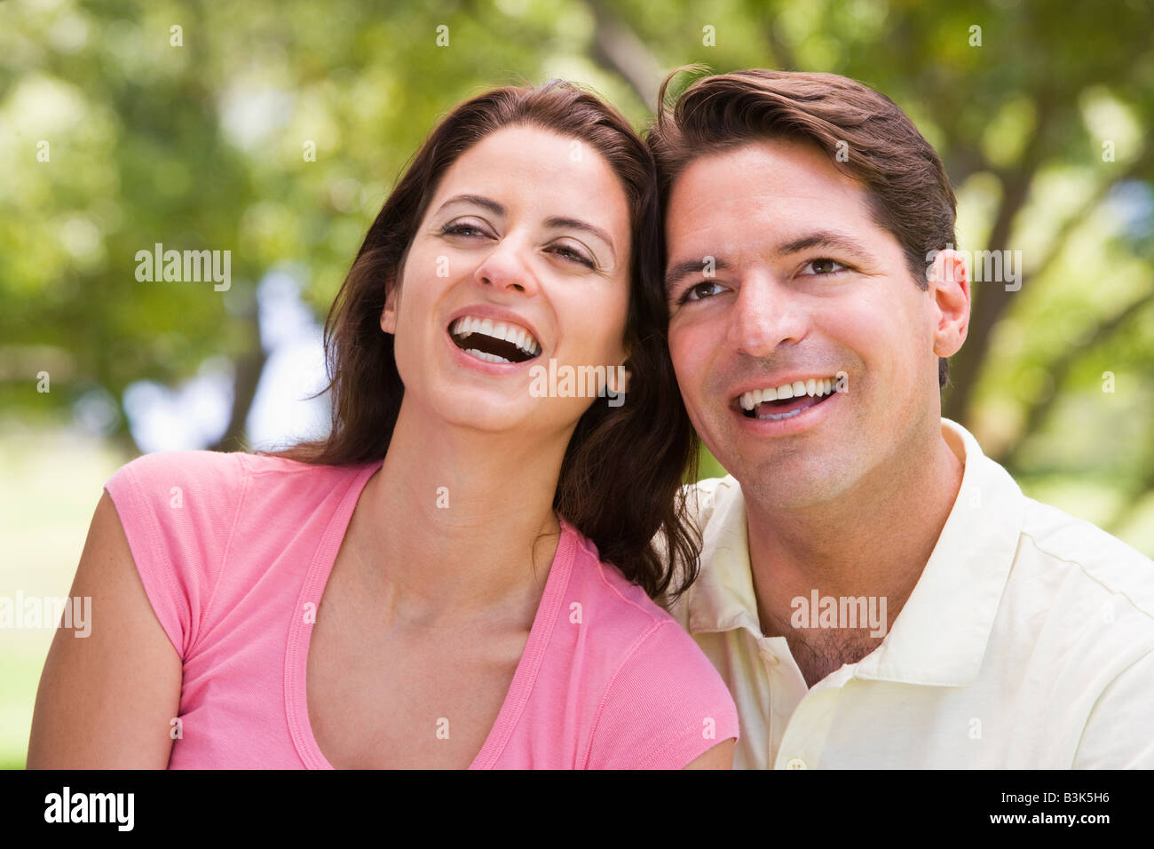 Couple outdoors smiling Stock Photo - Alamy
