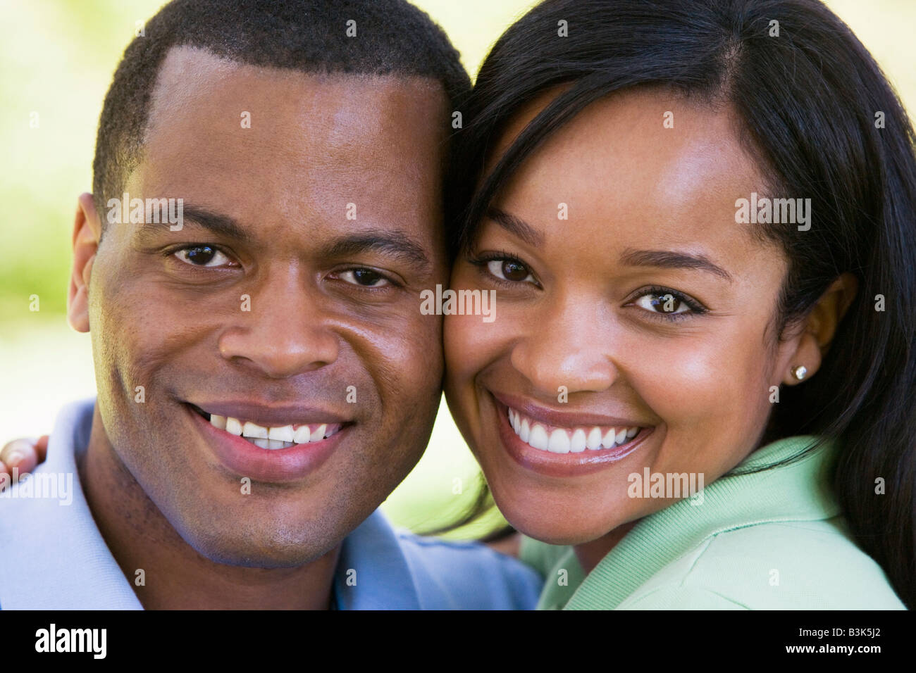 Couple outdoors smiling Stock Photo - Alamy