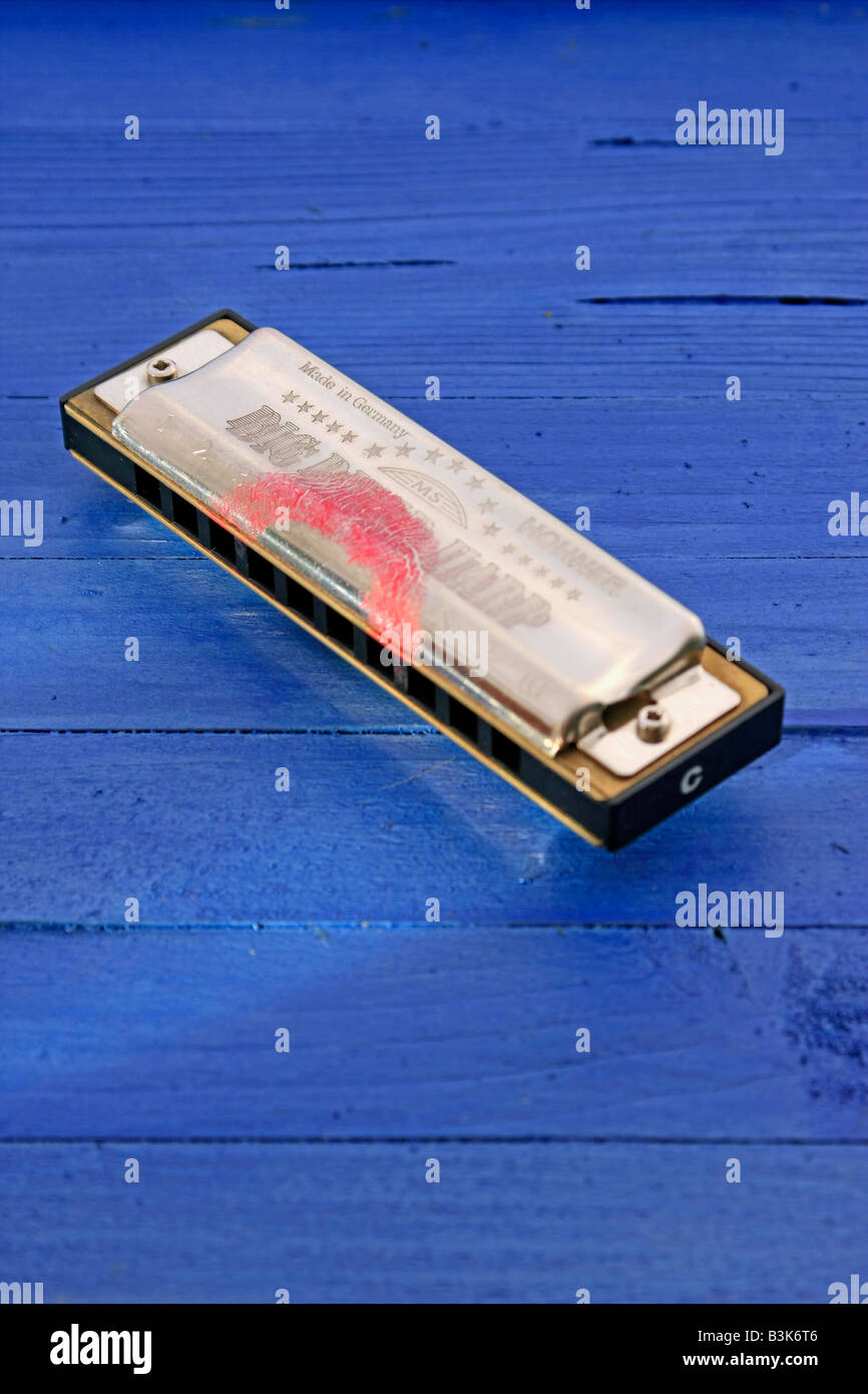 HARMONICA WITH LIPSTICK Stock Photo