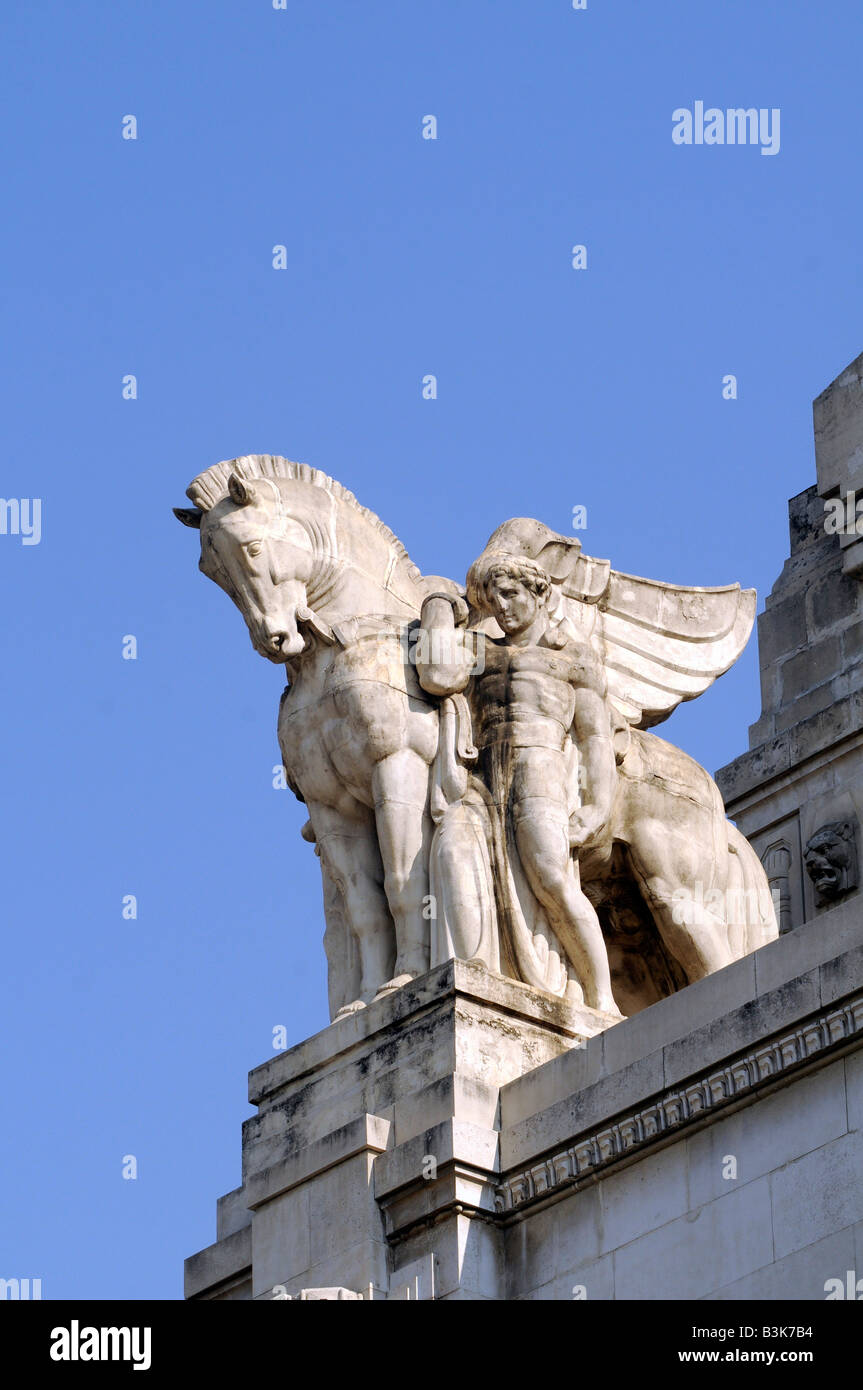Statue of a horse and a man on the roof of Milan central train station, a masterwork of grand fascist architecture, in Italy. Stock Photo