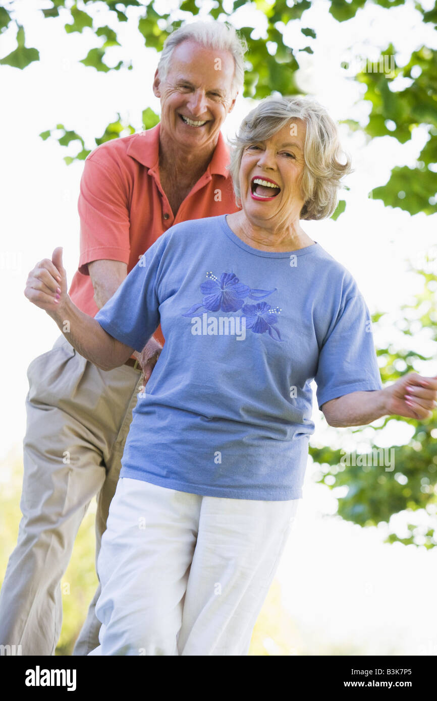Senior couple walking in park together Stock Photo