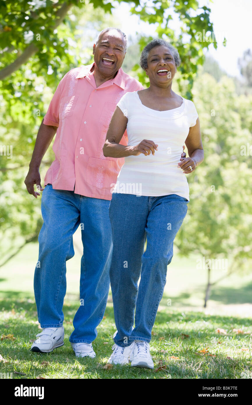 Senior couple walking in park together Stock Photo