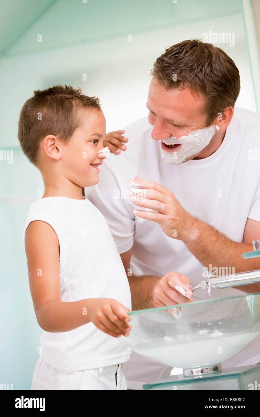 Young boys putting on shaving cream hires stock photography and images
