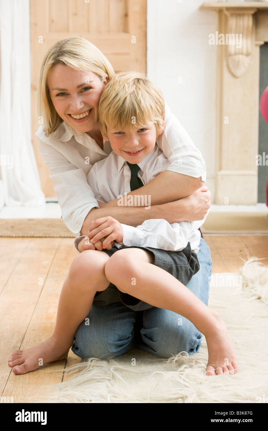 woman-in-front-hallway-hugging-young-boy-and-smiling-stock-photo-alamy
