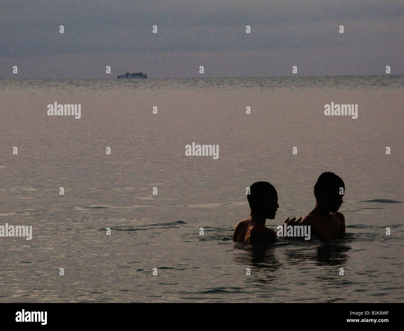 Two boys in the sea Stock Photo - Alamy