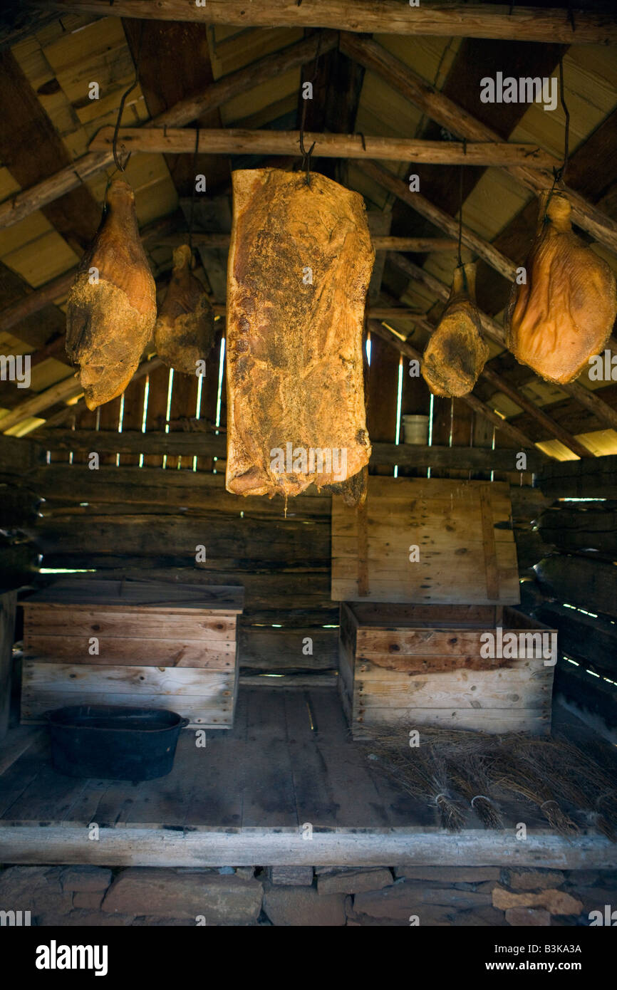 Intenrior of the Smokehouse with smoked pork and meats dried / curing at the Booker T. Washington National Monument, Hardy, VA Stock Photo