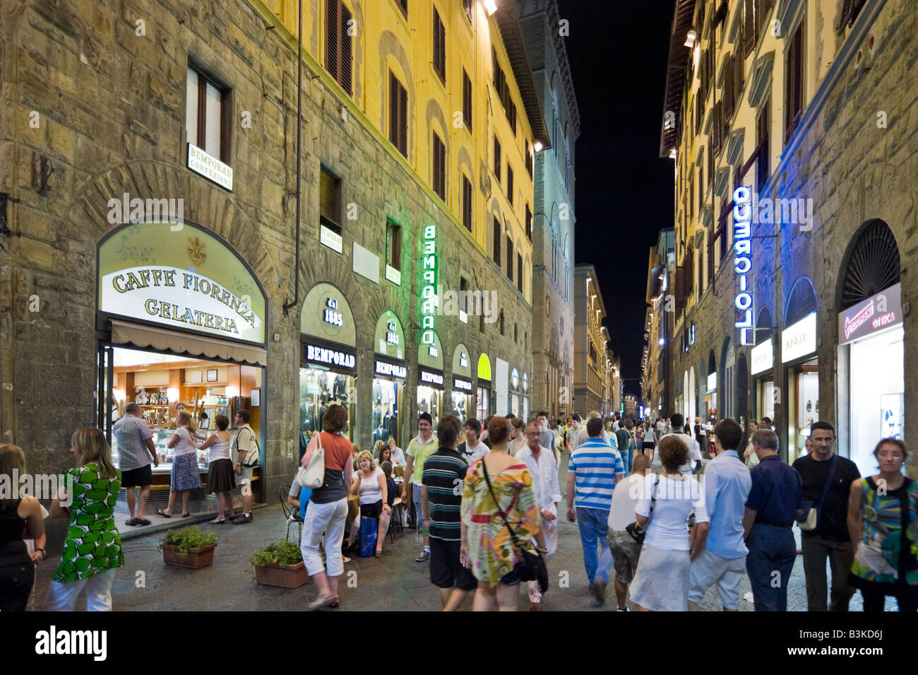 Crowded street at night near the Piazza della Signoria, Via dei Calzaiuoli, Florence, Tuscany, Italy Stock Photo