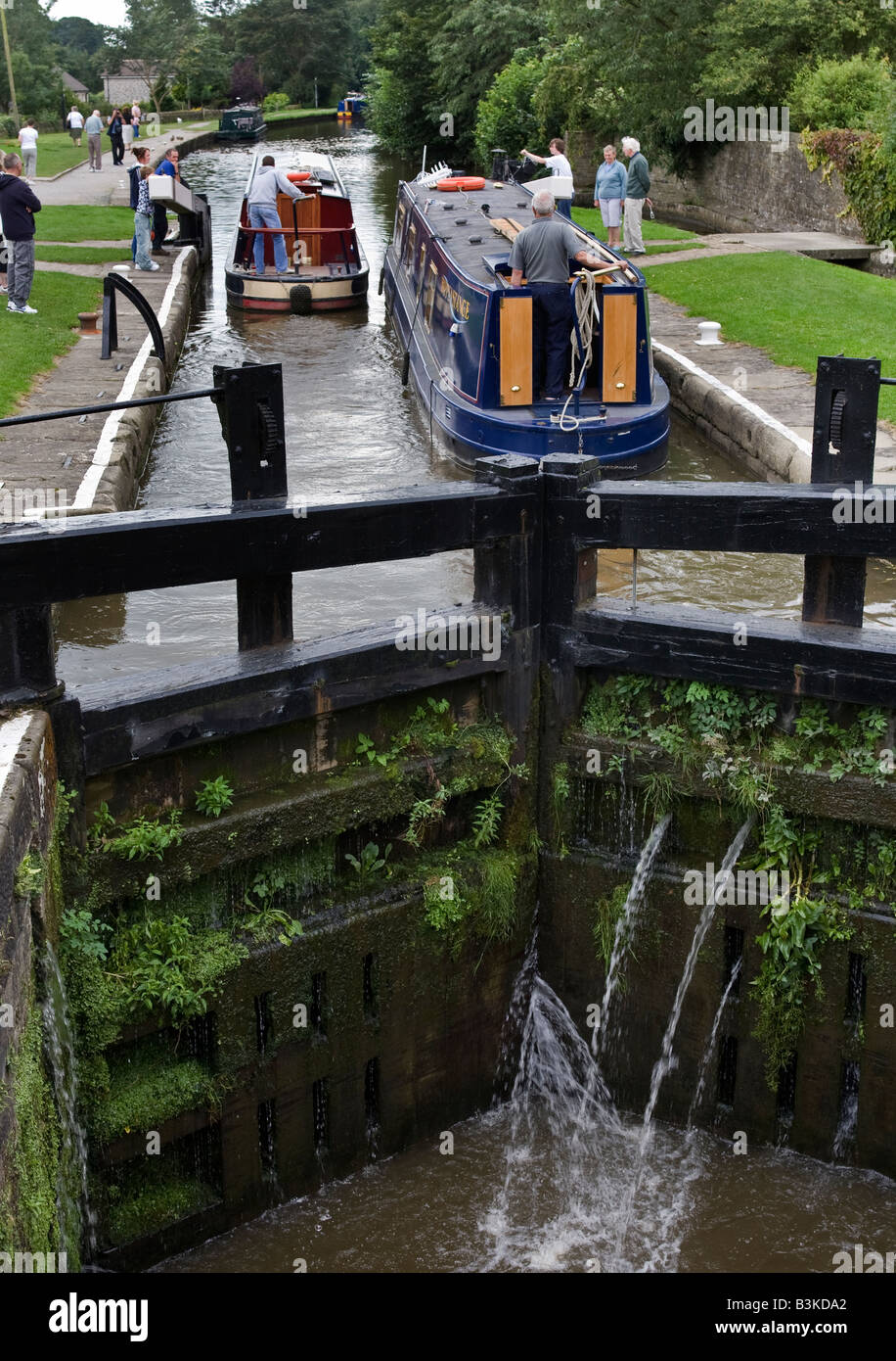 Canal narrowboats in a canal lock on the Leeds Liverpool canal. Stock Photo
