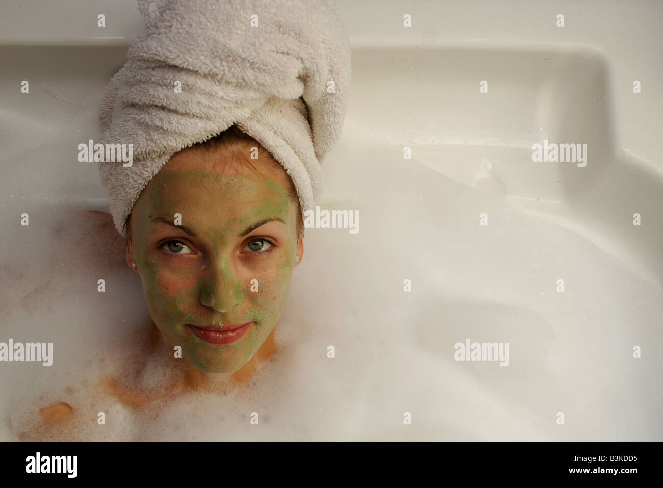 An attractive young lady relaxing in a bubble bath Stock Photo Alamy