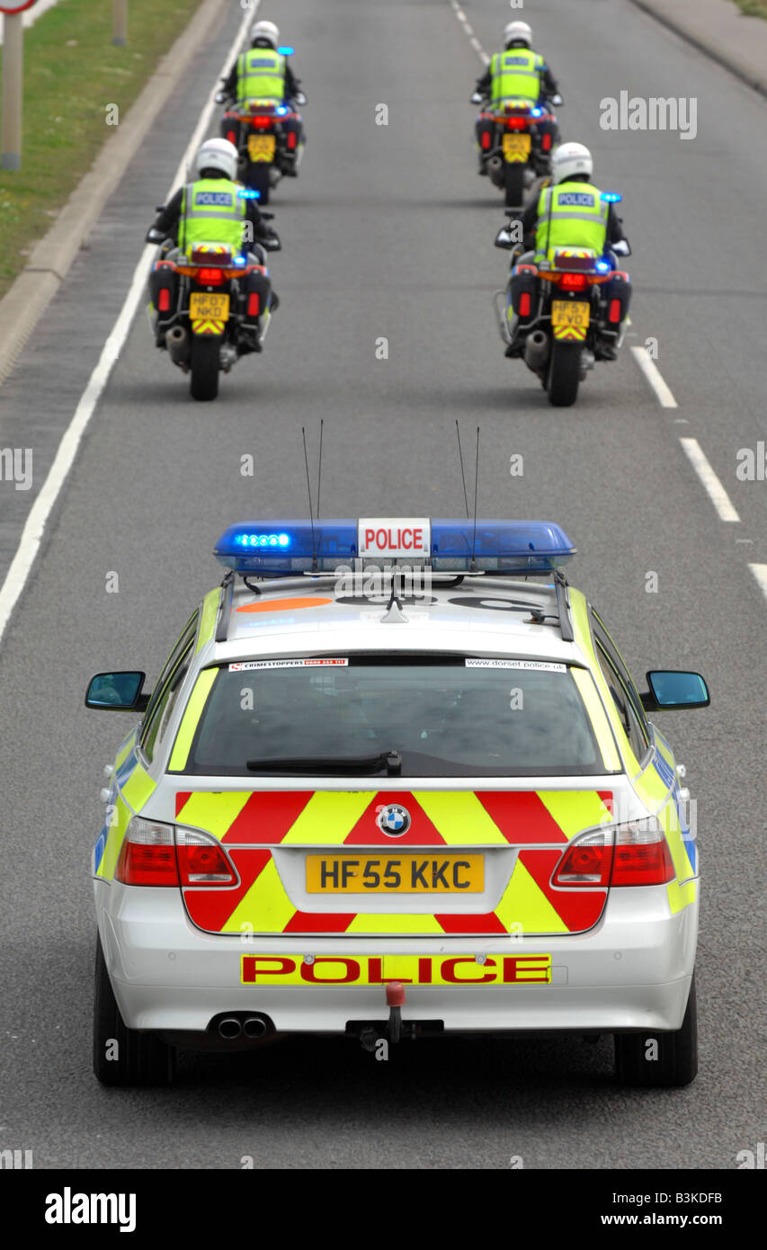 “Police Escort” police car and outriders Stock Photo