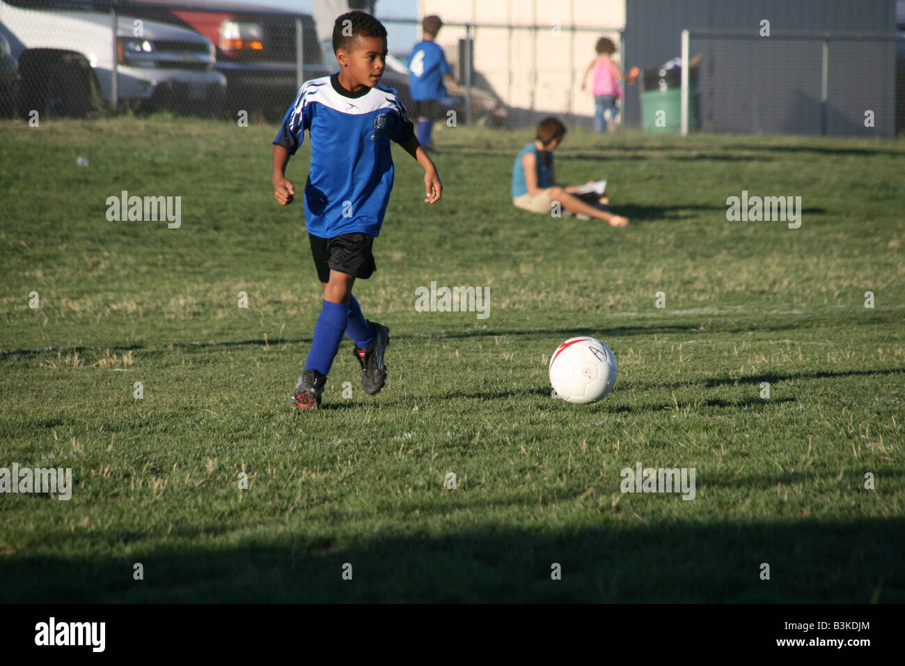 Photo of boy,male,soccer player going after the soccer ball Stock Photo