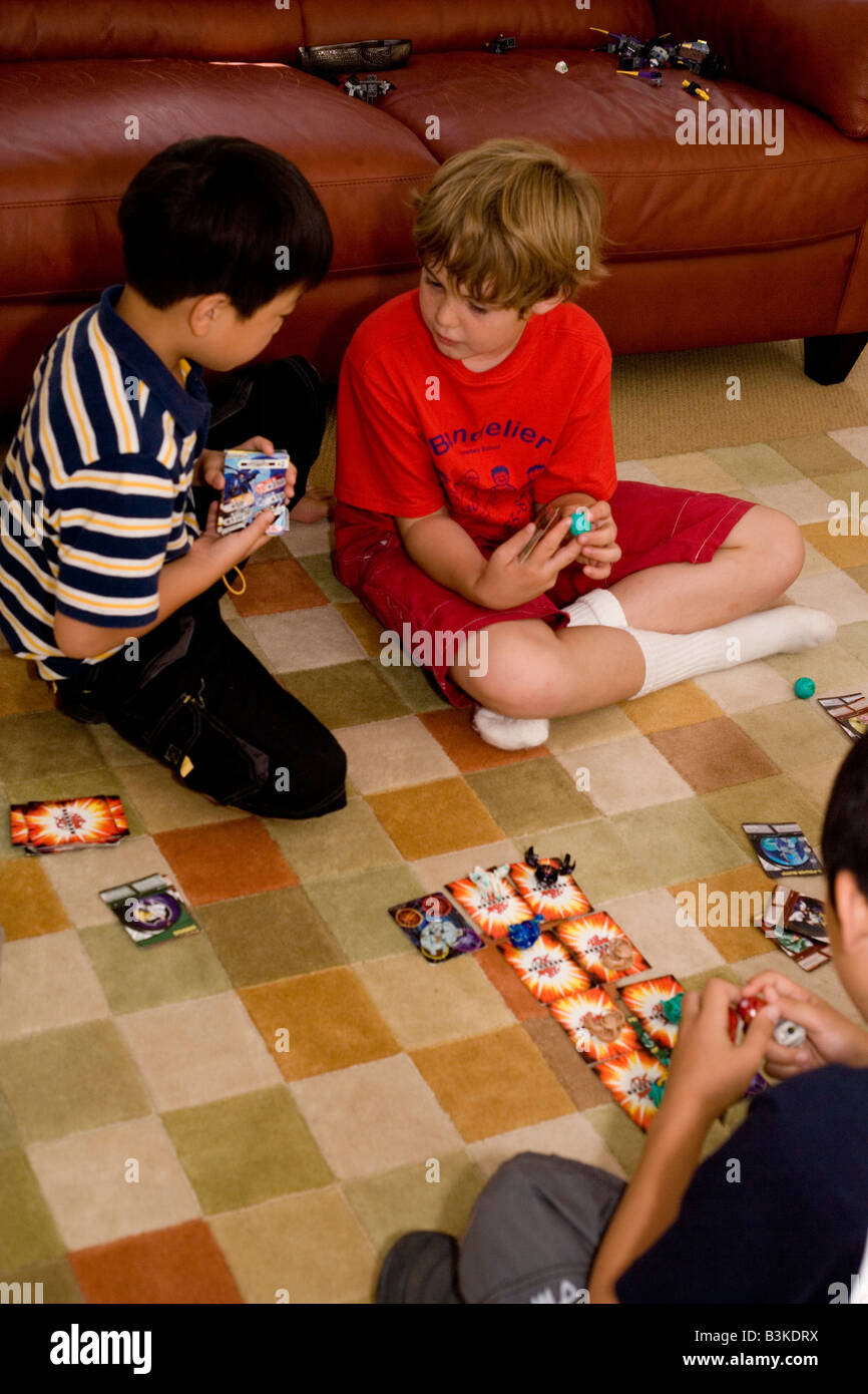 children playing Bakugan trading card game with Bakugan brawler balls Stock Photo