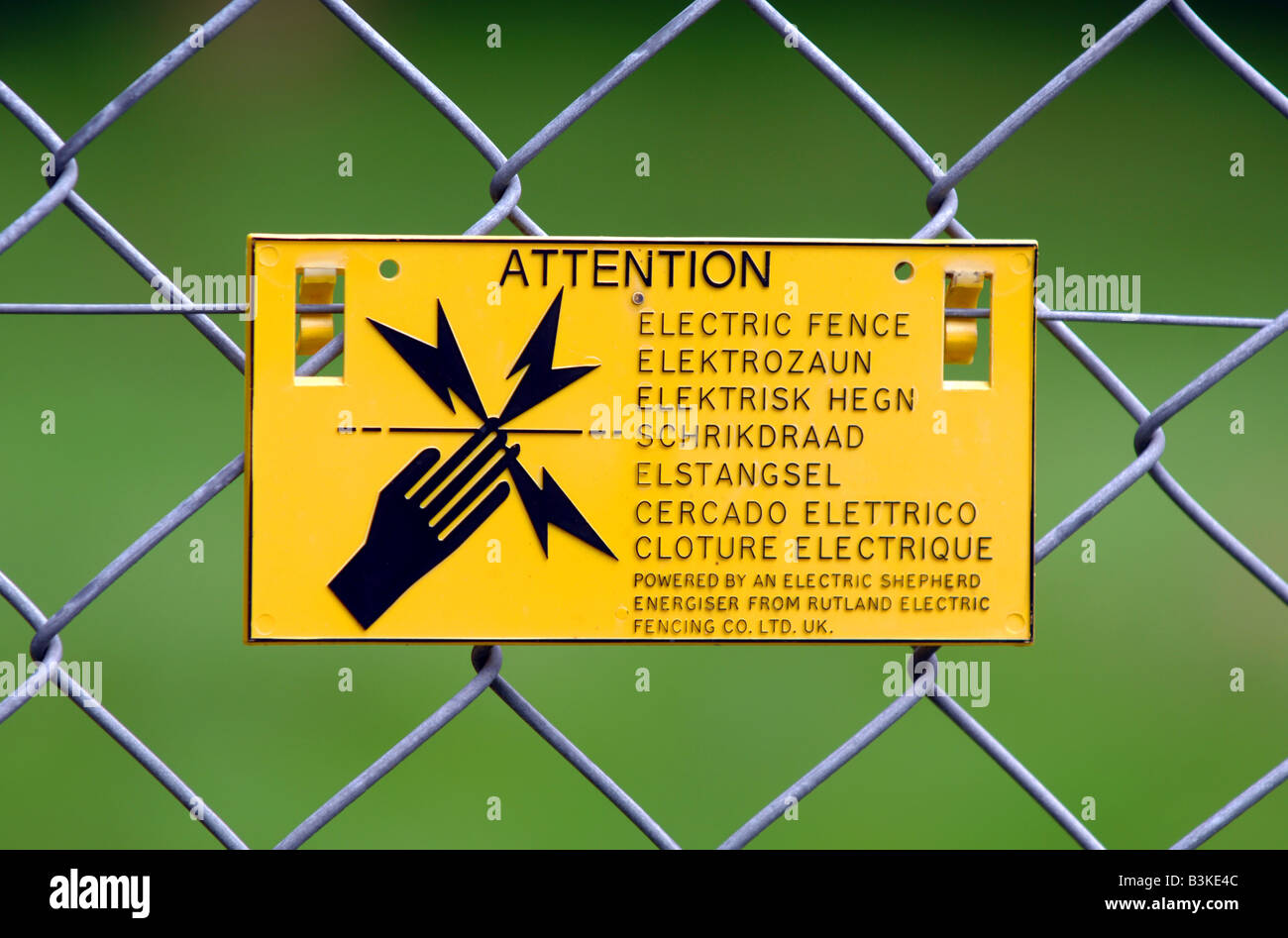 Electric fence warning sign Stock Photo