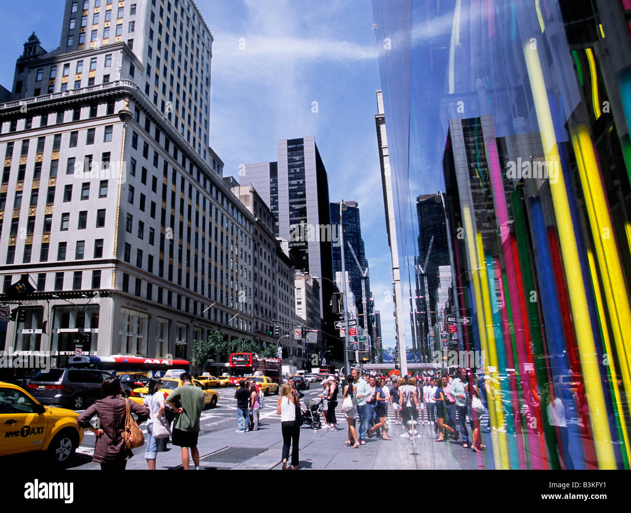 New York City Corner of Fifth Avenue and 57th Street on a busy day with crowds of tourists and shoppers. Stock Photo