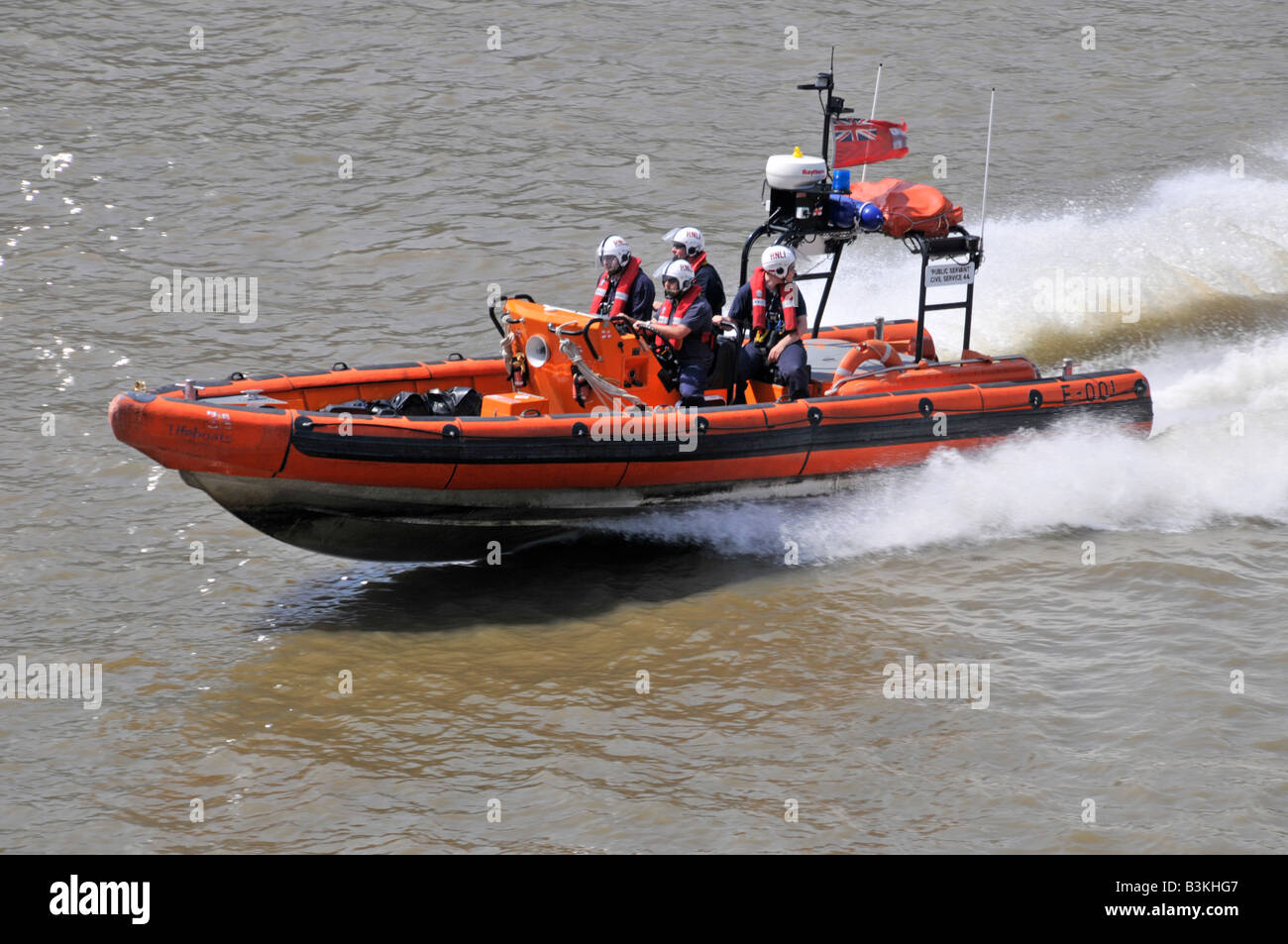 River Thames high speed Royal National Lifeboat inshore rescue craft at speed on emergency response London England UK Stock Photo